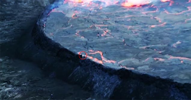 guy climbs away from lava pit