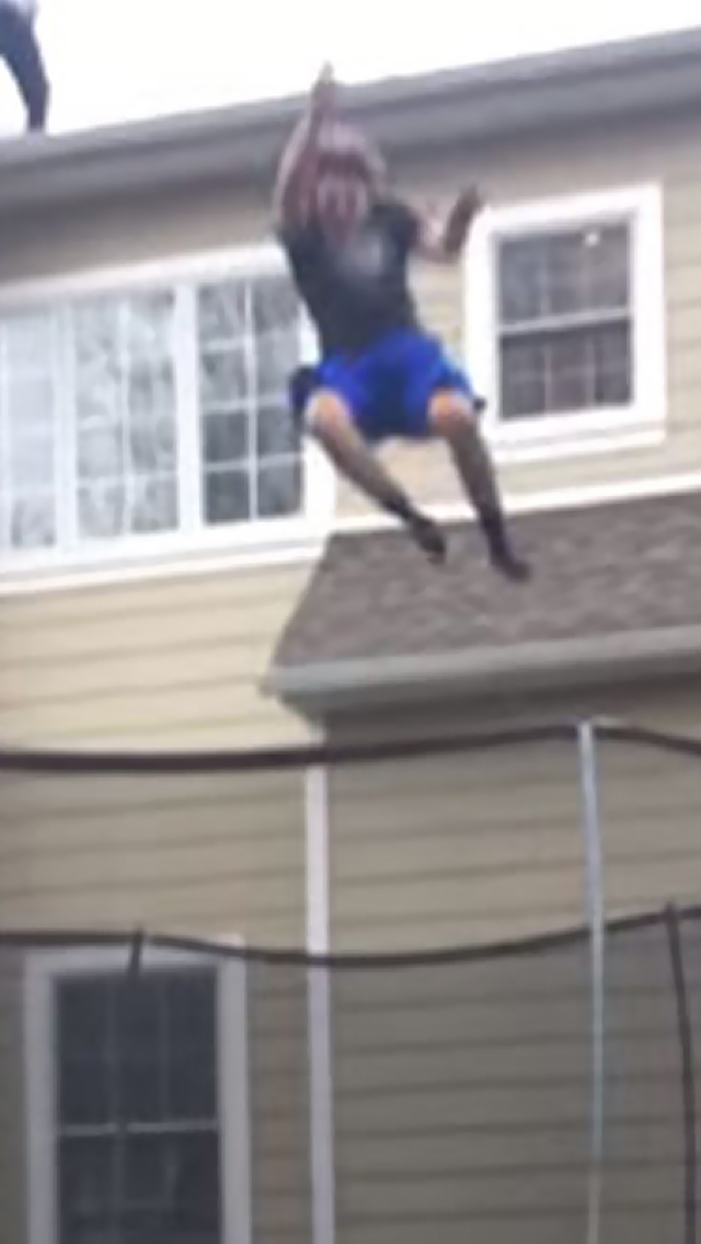 brave-idiot-s-roof-jump-onto-trampoline-doesn-t-go-as-planned-ouch-video-ebaum-s-world