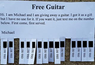 Picky douchebag gets trolled hard for acting like he's doing a favor for picking up a free guitar.
