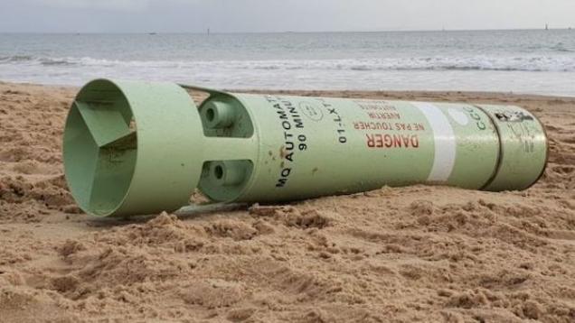 a photo of a marine marker that looks like some type of torpedo