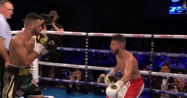 sam maxwell getting taunted in the ring of a boxing stadium