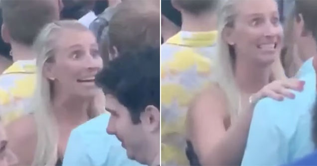 crazy looking girlfriend yelling at her boyfriend during a concert