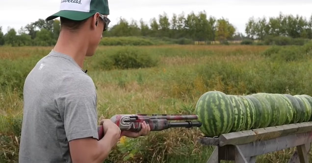 a man shooting a row of watermelons