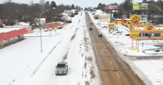 Footage of Texarkana street where Arkansas side is plowed and Texas side isn't