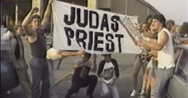 still from the movie heavy metal parking lot with kids holding up a Judas Priest sign