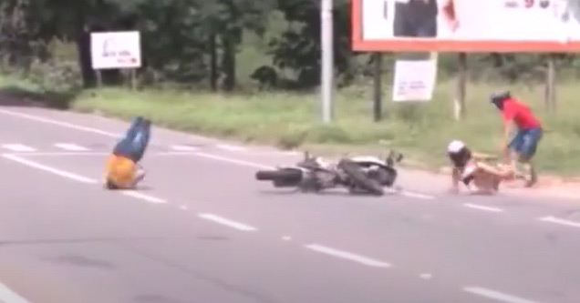 a bike crash on the side of the road | couple crashes on their motorcycle