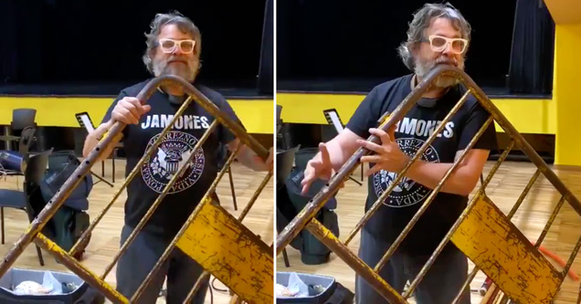 professional musician xavier lozano playing a flute made from a metal street barrier