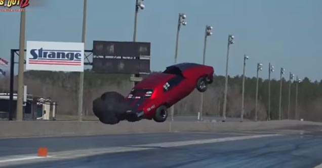 a red drag race car flying through the air