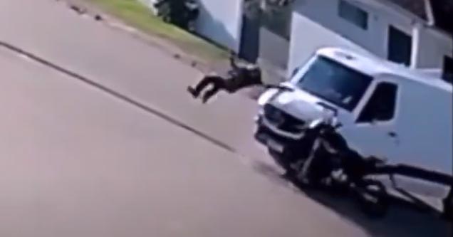 a biker hitting a van and flipping over it