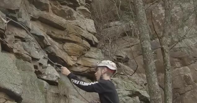 a rock climber wearing a helmet