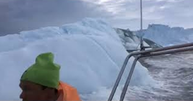 a huge wave from a tsunami caused by an ice berg