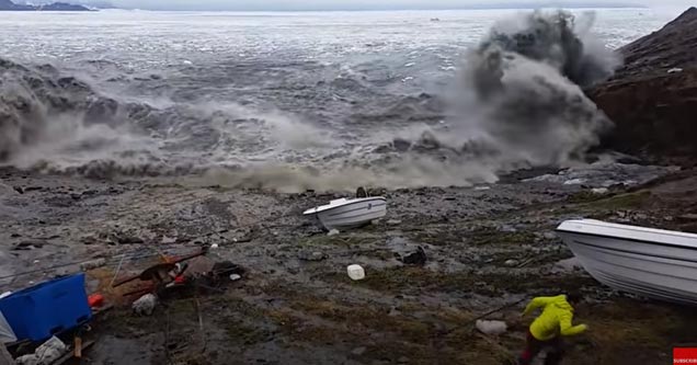 a huge tsunami wave hitting the shore by fisherman