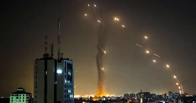 photo - Palestinian rockets being fired at Israeli building