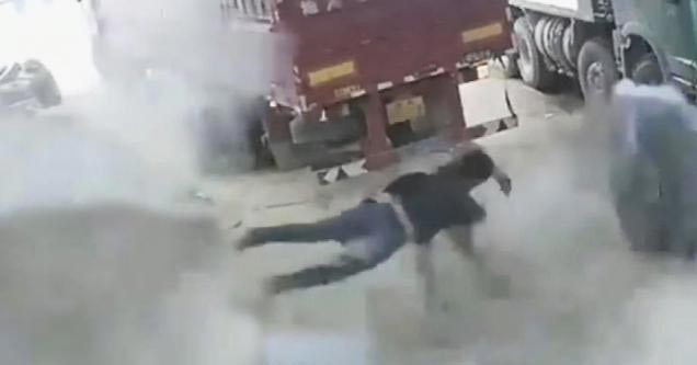 a man flying across the shop after a tire exploded