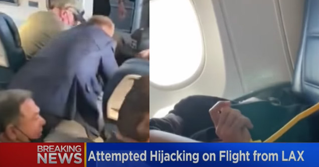 crew and passengers holding a man down who tried to hijack plane