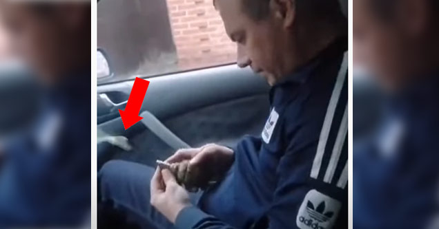 a man messing with a grenade in a car before the pin comes out