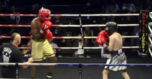 Aaron Carter (silver/black) faces off against Lamar Odom (yellow) in celebrity boxing match