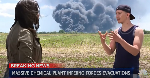 a man talking to a local reporter about a chemical plant fire