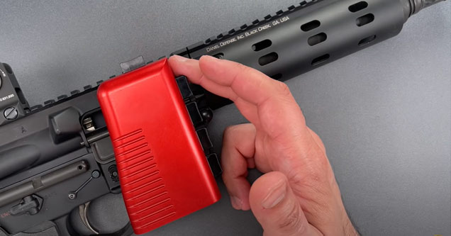 a red chamber lock on an ar-15