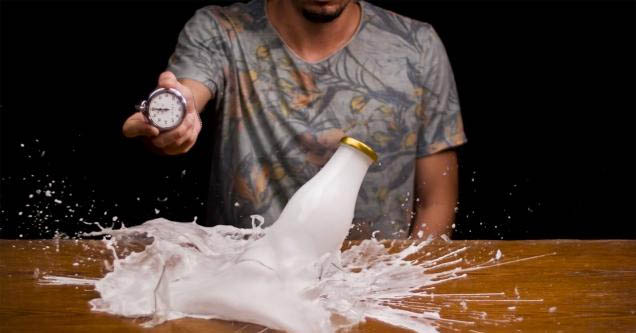 milk bottle breaking in time warp effect video by Macro Room