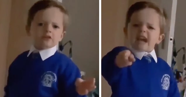 Kid in school uniform getting mad at santa on camera.