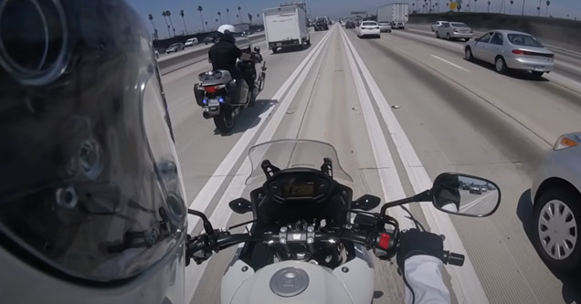 biker about to pass a motorcycle cop