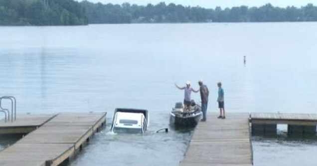 a truck that drove off the boat loading ramp