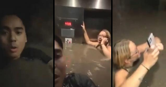 people trapped in an elevator that is flooding