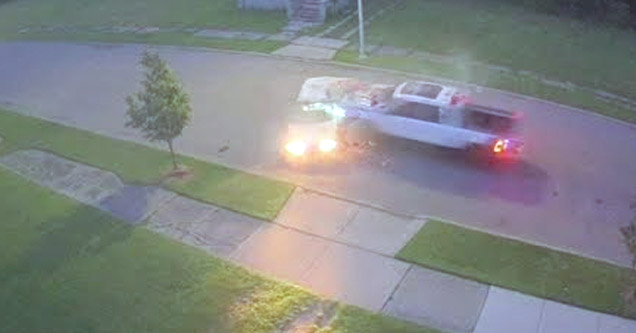 a car hit by a speeding truck in a neighborhood