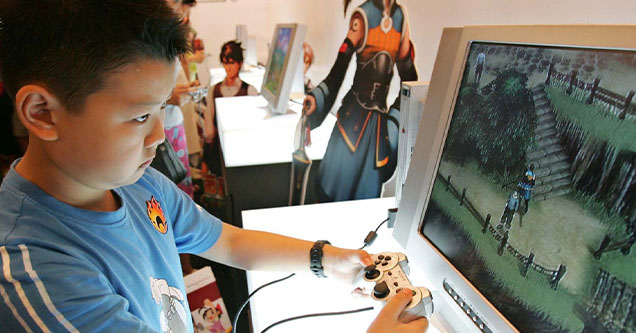 chinese kid playing a video game