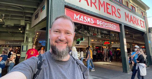 John Gibson CEO of Tripwire Studios standing in front of a Farmers Market in Seattle -  recently ousted from his role at Tripwire