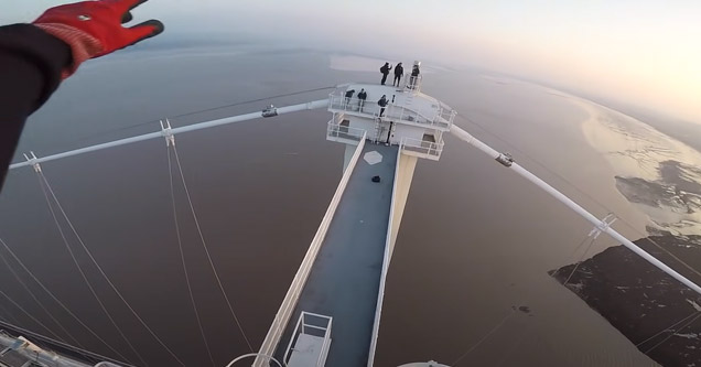 guys on top of the bridge