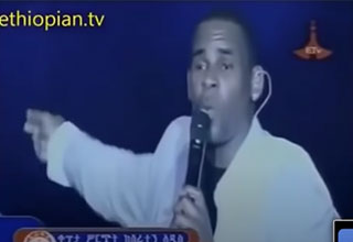 R Kelly in Ethiopia singing a song trying to recruit women to follow him to America