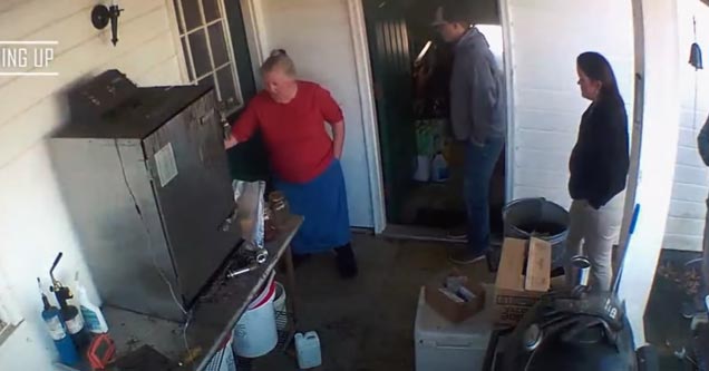 people standing on the porch of a house where a man recently died