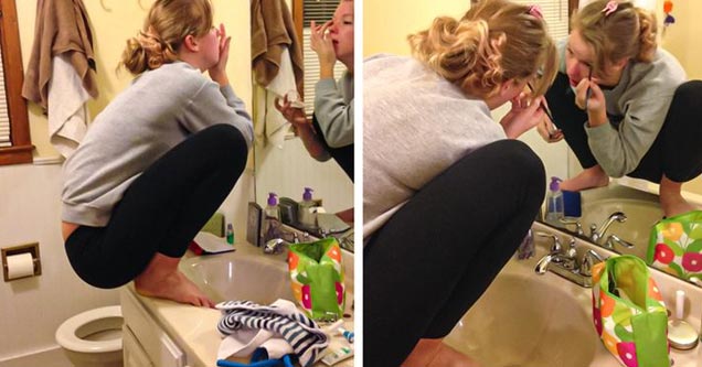 woman putting on make up sitting on counter