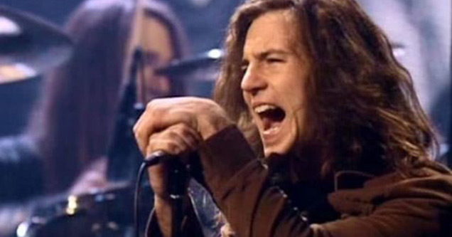 eddie vedder singing on stage early on in his career