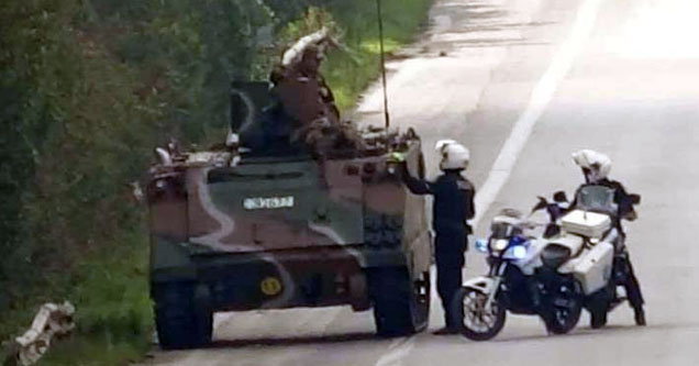 cops pulling over a tank