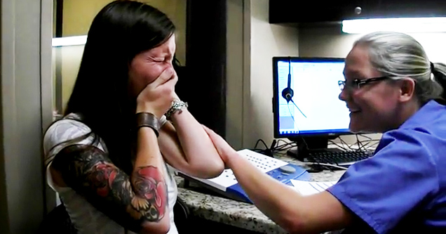 a woman crying after getting a hearing aid and hearing for the first time