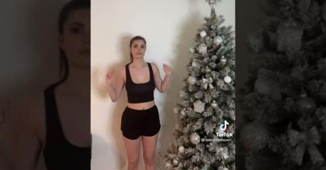 lady demonstrates her clap-activated christmas light w/ boob claps