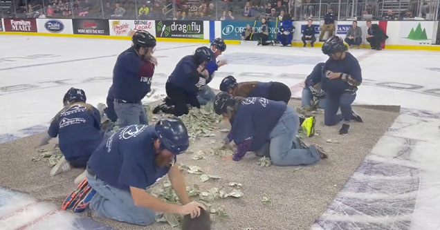 South Dakota teacher fight over one dollar bills in a sash for cash event