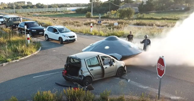 a fake ufo and alien on a street in france