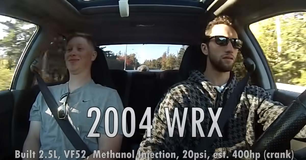 two guys driving a subaru wrx