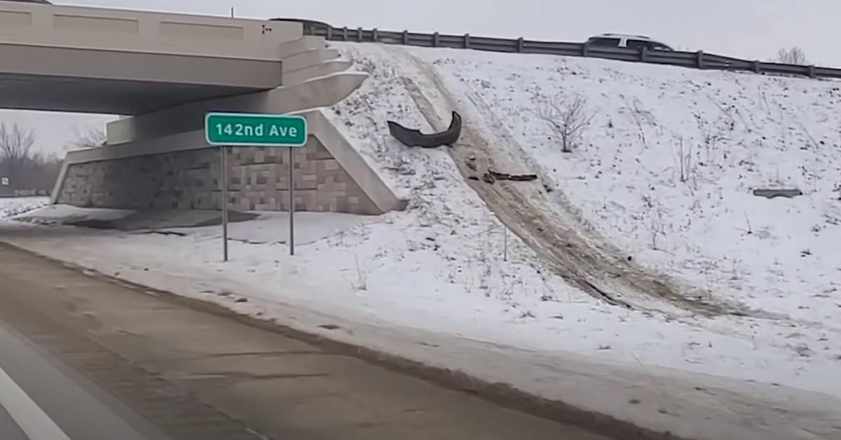 car hit a snowy embankment and jumped over a bridge