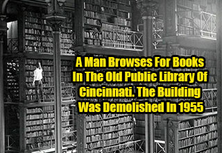 photo of a man inside a massive public library