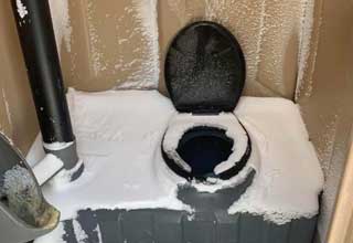 a porta potty that snowed inside