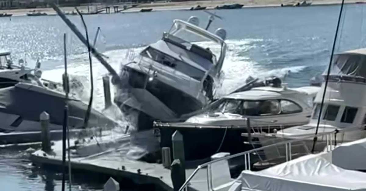 a yacht crashing into boats at a marina