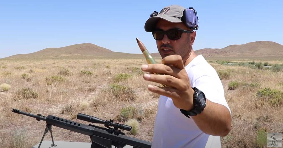 guy holding a .50 caliber round