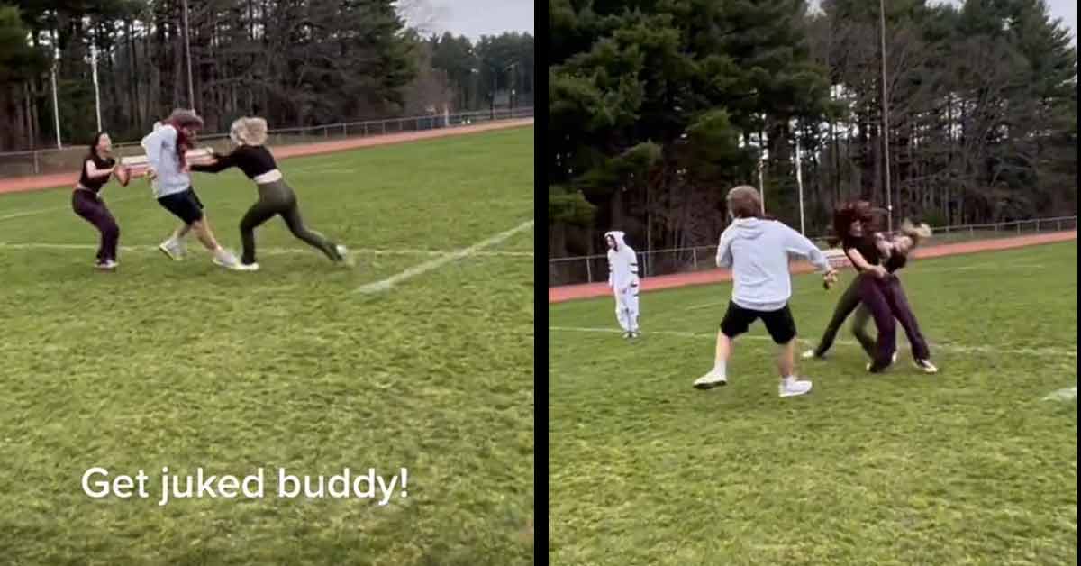 two girls slamming into eachother playing football