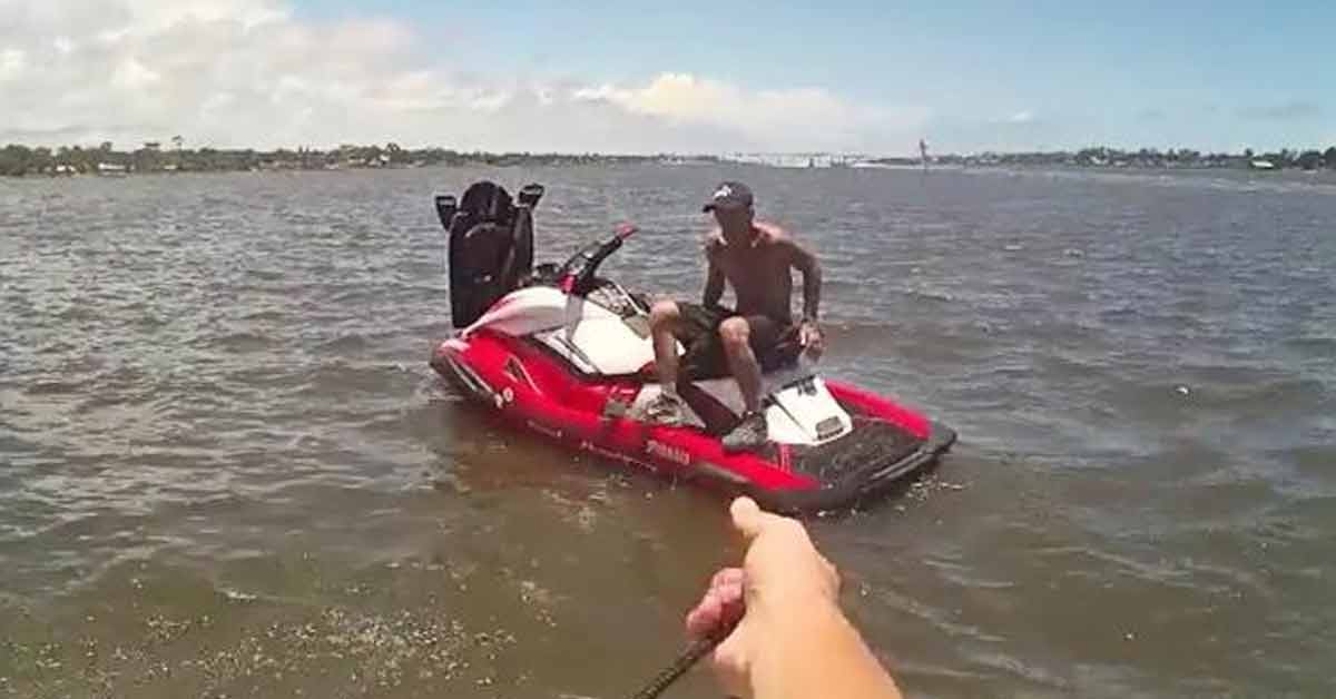 man stealing a jet ski