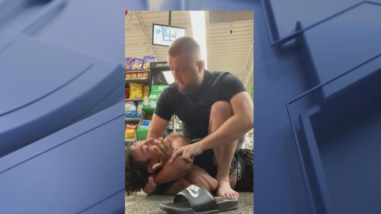 a man with a black belt holding a thief on the ground				           chicago black belt takes down man who allegedly punched 7eleven clerk criminal owned man arrested